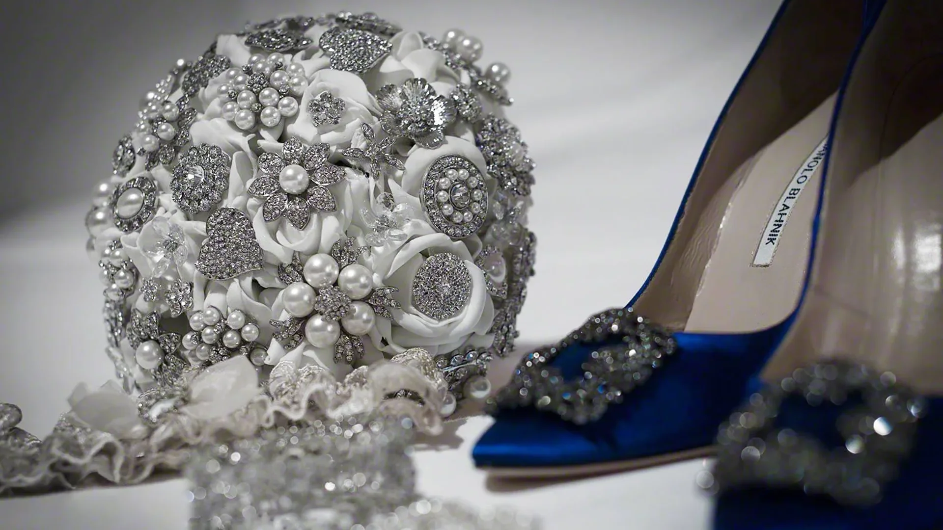 Bouquet of silver broaches and Manolo Blahnik shoes